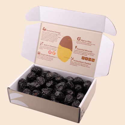 Open 454 g Mighty Mejdool Ajwa dates box showing dark, smooth premium dates and printed nutrition benefits inside the lid.